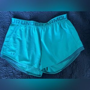 Size large Under Armour turquoise teal blue green athletic shorts.